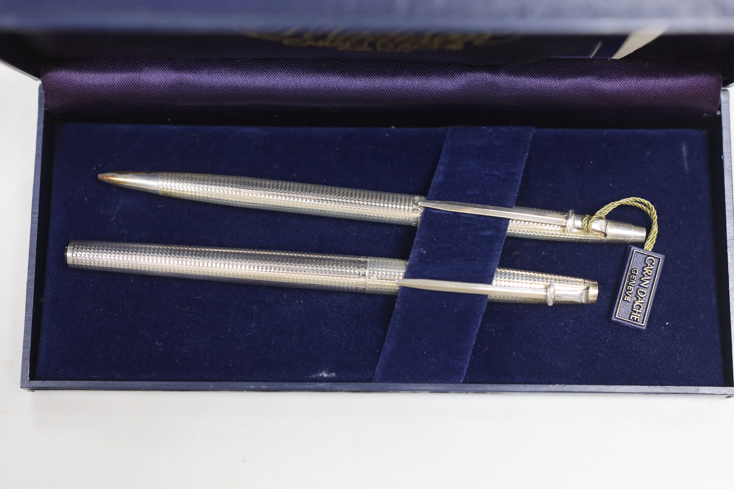 A cased Madison silver pen and pencil